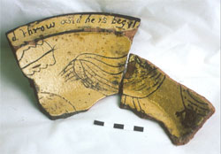 Fig 13 Fragment of white slip-coated dish with sgraffito design depicting a bird with the motto 'd throw and he is begyl'. Excavated from the kiln site at Brookhill Pottery