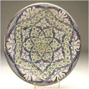 Louise Powell, plate in white earthenware with hand-painted under-glaze leaf and frond decoration in red, green and pink lustre, c.1928