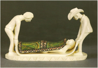 Sculpture by Nhlanhia Nsundwane which shows Moses Nqubuka and Fee Halsted carrying the artist, Punch Shabalala, 2002. Painted in 2008 by Shabalala.